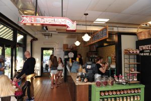 Inside Belvedere Square Market where customers can order savory and sweet foods.