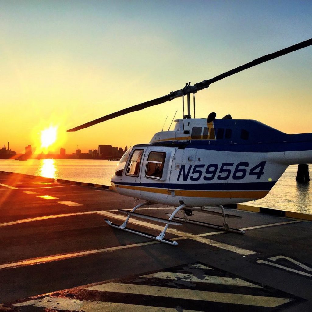 Helicopter landing during sunset in Baltimore City.
