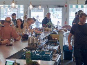 People enjoying their time with food and drink at Grand Cru in Belvedere Square.