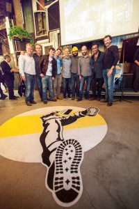 Individuals who worked on The Hall SF and Scott Plank posing for a group photo.